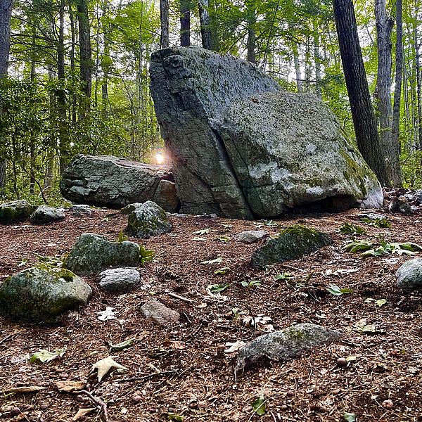 A striking rock formation that appears to swallow the setting sun during the summer solstice.